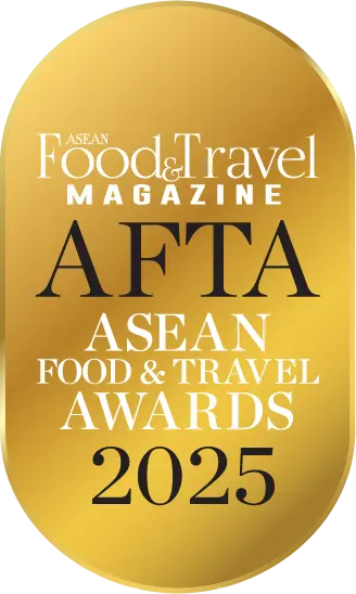 Gold medal-style badge with layered text that reads 'ASEAN Food and Travel Magazine', 'AFTA', and 'ASEAN Food and Travel Awards 2025